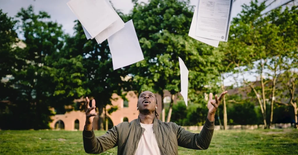 Black male recruiter managing job applications as part of the hiring process