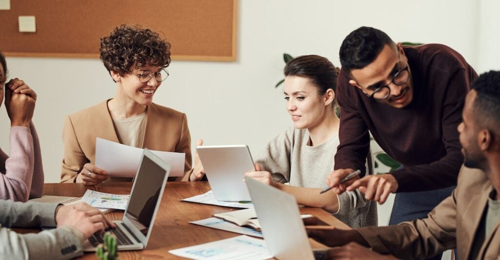 Canadian employees reviewing criminal record checks Canada FAQs on laptop