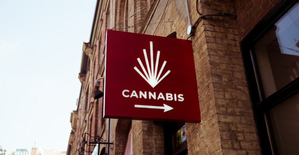 Cannabis store sign requiring criminal record check