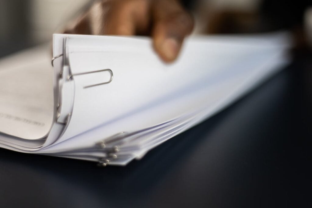 HR professional reviewing background check reports and preparing an adverse action notice in line with FCRA requirements