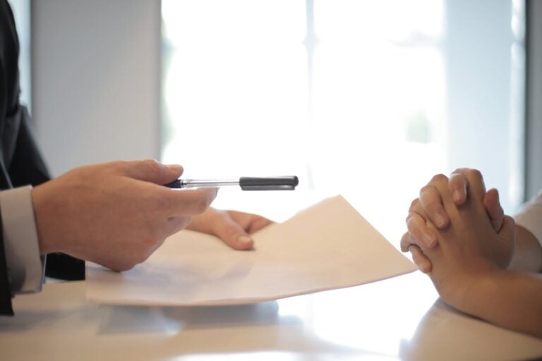 New employee receiving contract to sign representing FCRA background check requirements